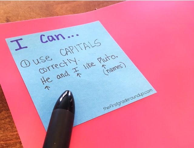 upclose of post it note writing anchor chart
