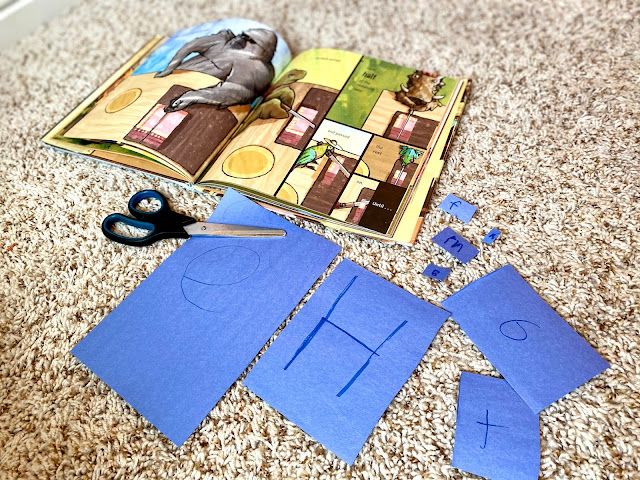 cutting fractions out of blue construction paper with the story